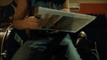 a person is holding a piece of paper that says queen on it