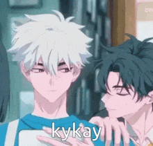 a couple of anime characters standing next to each other .