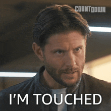 a man with a beard says " i 'm touched "