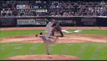 a baseball game is being played between the ny yankees and the dodgers