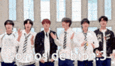 a group of young men in school uniforms and ties are standing in front of a window and singing .