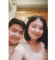 a man and a woman are posing for a picture and the date is 2020