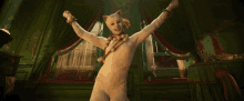 a white cat with a necklace around its neck is dancing