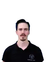 a man with a beard and mustache looks at the camera