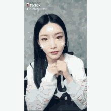 a woman with snowflakes on her face and a tik tok id