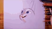 a person is drawing a rabbit with colored pencils on a piece of paper that says prismacolor