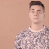 a man is holding a red tambourine in his hands and waving .