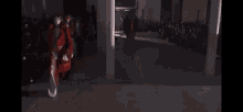 a group of people walking through a dark tunnel