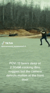 a tiktok video shows a man holding a gun in a field