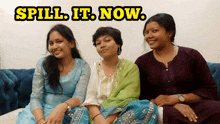 three women sitting on a couch with the words spill it now written above them