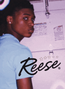 a young man in a blue shirt with the name reese on the bottom