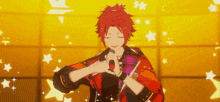 a man with red hair is singing into a microphone on a stage surrounded by stars .