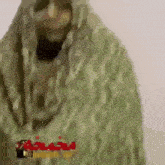 a blurry picture of a person in a camouflage suit .