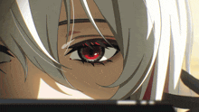 a close up of a person 's eye with a red eye
