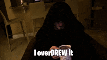 a man in a hooded sweatshirt is holding a cup of coffee and says " i overdrew it "