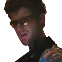 a man wearing sunglasses and a backpack smiles for the camera