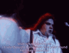 a man with red hair singing wait what is going on i truly thought halloween was year round
