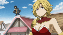 a woman in a red dress stands in front of a building with a man on the roof