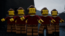 a group of lego figures are standing in a row