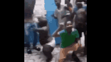 a group of people are dancing together in a room .