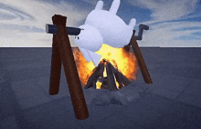 a cartoon bunny is laying on its back in front of a fire .