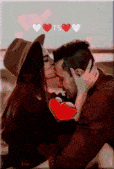 a painting of a man and woman kissing with the word ts in the corner
