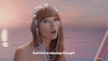 a woman is wearing a headband with pearls and the words karma 's a relaxing thought .
