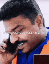 a man with a mustache is talking on a cell phone with the caption when a conqueracker is talking