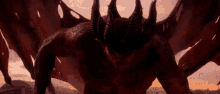 a devil with horns and wings is standing in the dark .