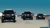 a chevrolet suv is driving down the highway