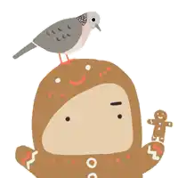 a bird is perched on top of a gingerbread man 's head