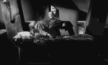 carrying the monster son of frankenstein boris karloff taking to bed