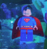 a lego figure of superman with a red cape on