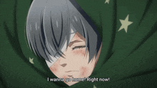 a man with a bandage on his eye is wrapped in a green blanket and says i wanna go home right now