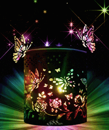 a colorful candle holder with butterflies on it