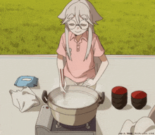 a girl in a pink shirt is stirring a pot of water with chopsticks