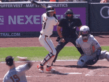 a baseball player with the number 1 on his jersey swings at a ball