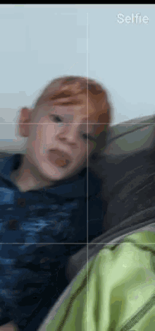 a screenshot of a child taking a selfie on a cell phone