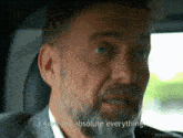 a man with a beard is sitting in a car and says i gave my absolute everything
