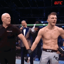 winner dan hooker raising arms tongue out ultimate fighting championship