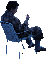 a man in a robe is sitting in a chair looking down