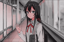 a girl in a school uniform is walking down a hallway with a purse that says ' a ' on it