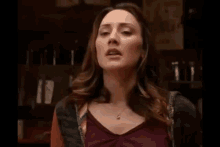 a woman with her eyes closed and her mouth open