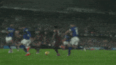 a soccer game is being played in front of an ad for fleximize.m
