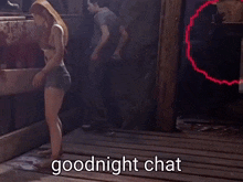a woman standing on a wooden floor with the words goodnight chat written on it