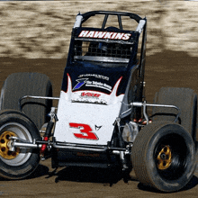 a race car with the number 3 on the front of it