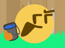 a drawing of a smiley face with a bucket of water next to it