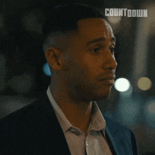 a man says that 's great in front of a countdown logo