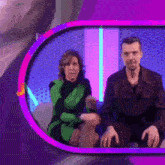 a man and a woman sitting in front of a mirror