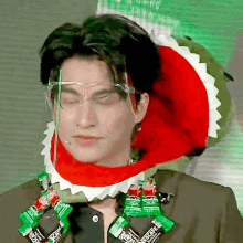 a man wearing a shark costume and a necklace of nescafe coffee packets